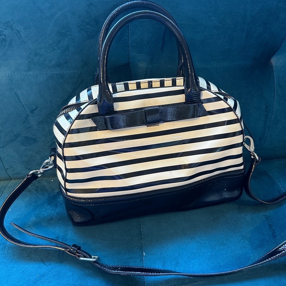 Black and white patten leather Kate spade bowler style bag with bow